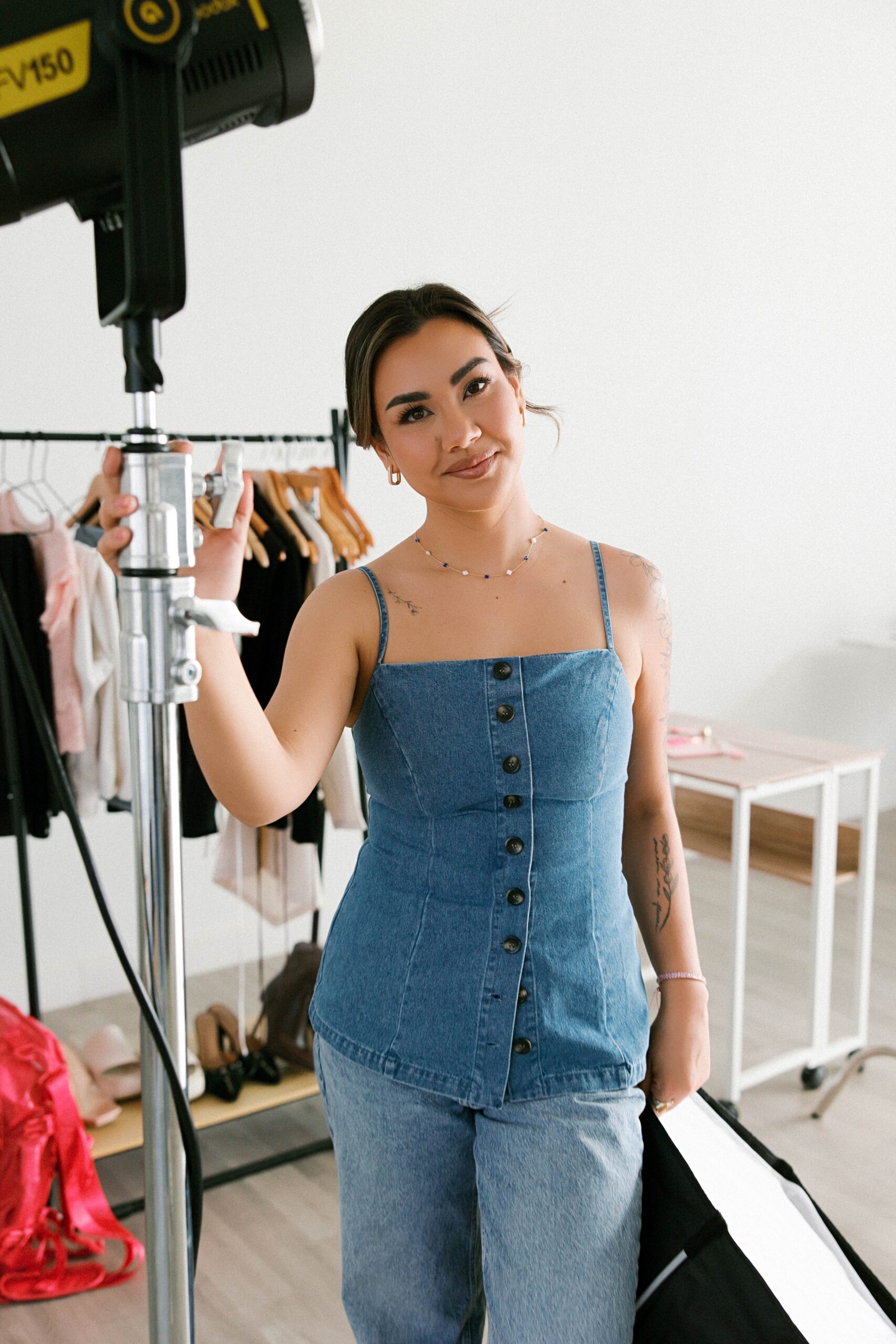 Photographer Holding Camera equipment in Richmond Virginia Photo Studio