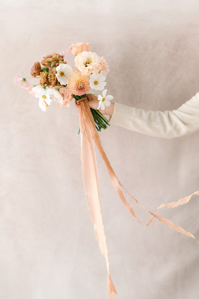 Detail photo of a floral bouquet and ribbon detail