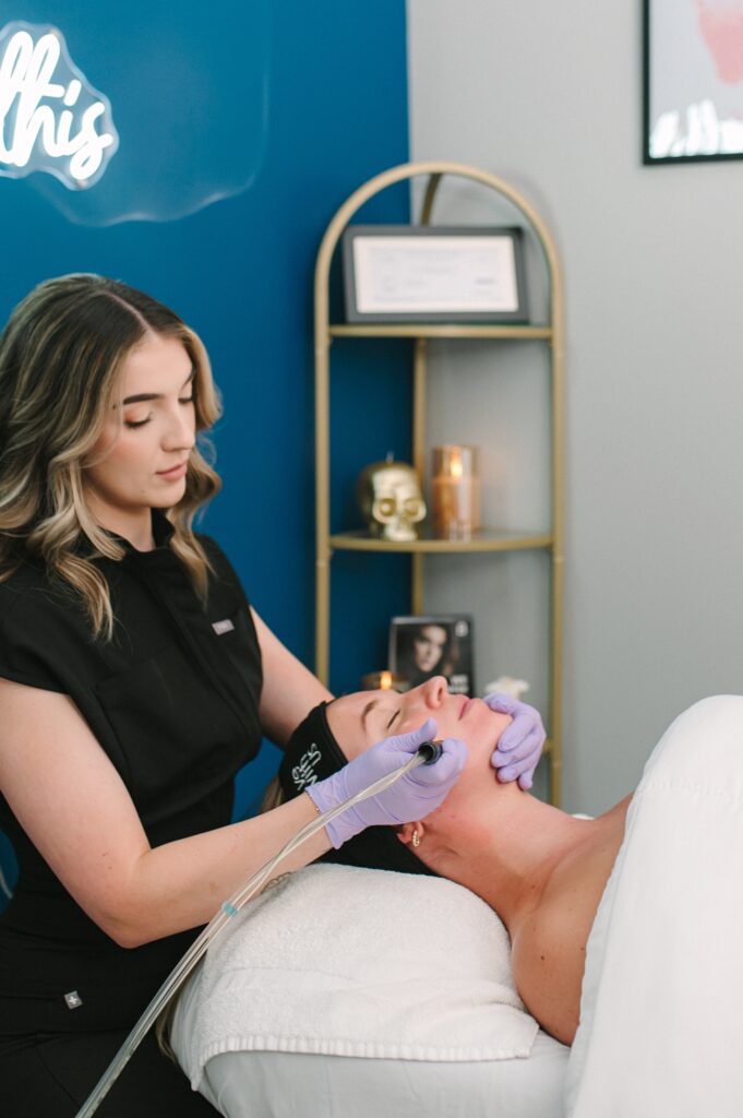 Detail shot of a facial treatment being performed by Skin by Victoria during a professional brand photoshoot.
