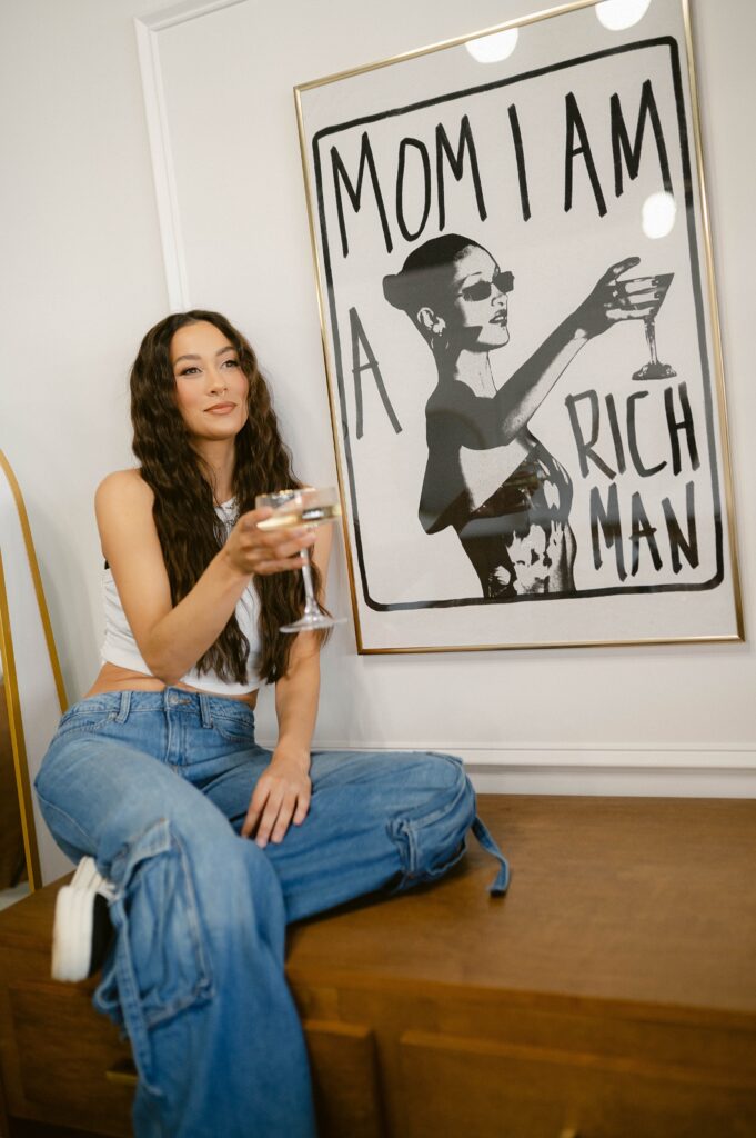 Beauty entrepreneur celebrating success during a playful branding photoshoot