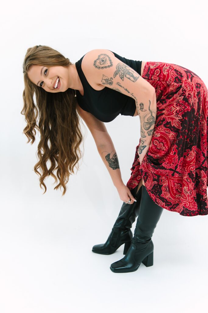 Authentic branding photo featuring movement and personality, styled with thrifted clothing worn daily by the client