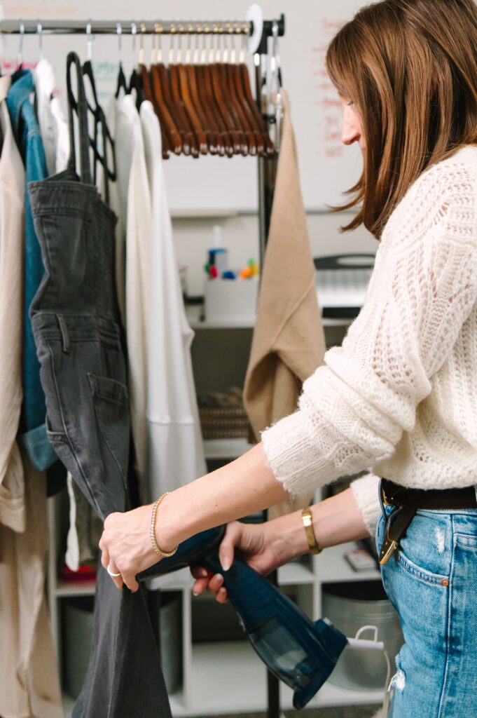 Preparing outfits for branding photography for a flower market with intentional styling