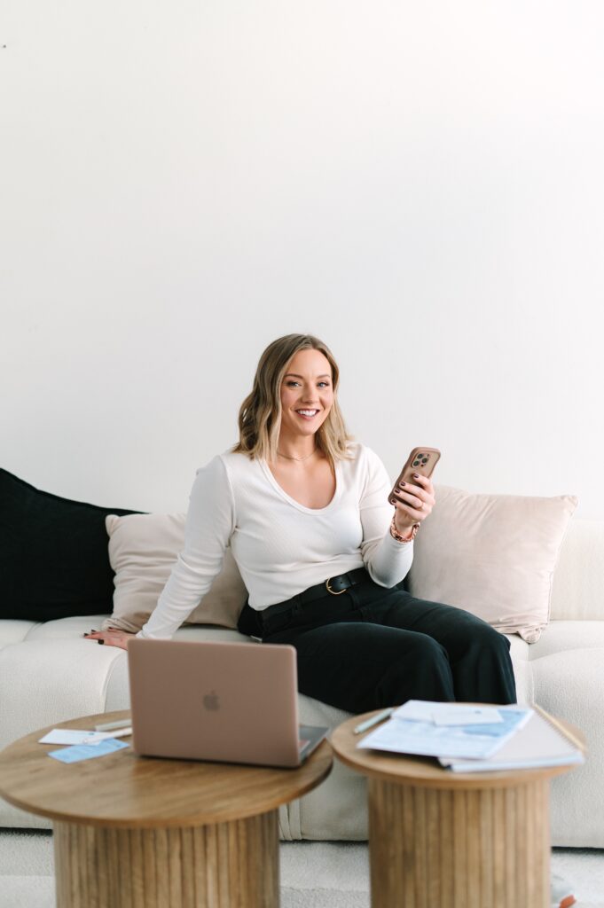 Dietitian agent checking phone and laptop during a lifestyle branding photoshoot