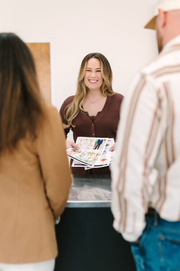 Florist leading a DIY flower consultation during branding photography for a flower market.