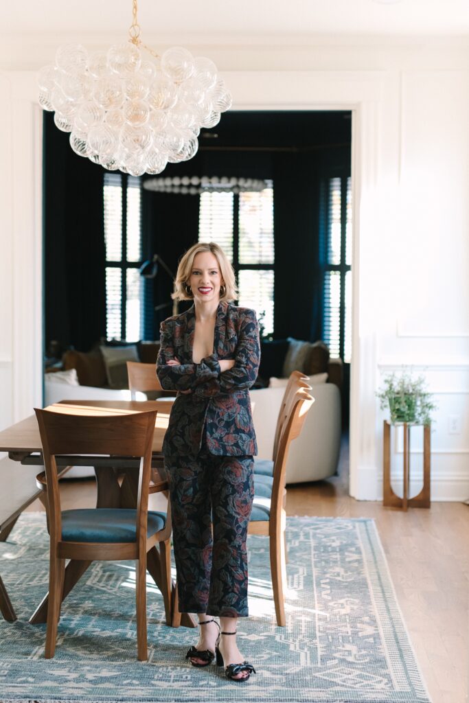 Luxury interior designer walking through a styled home during a personal branding session