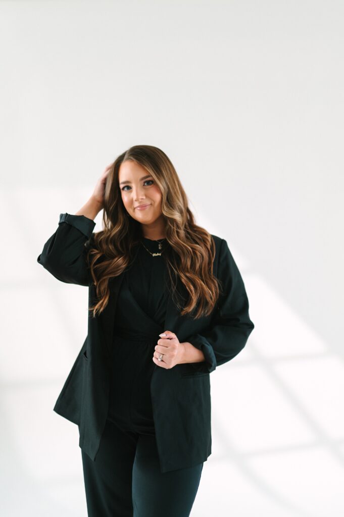 Studio portrait of a professional makeup artist for personal brand photography.