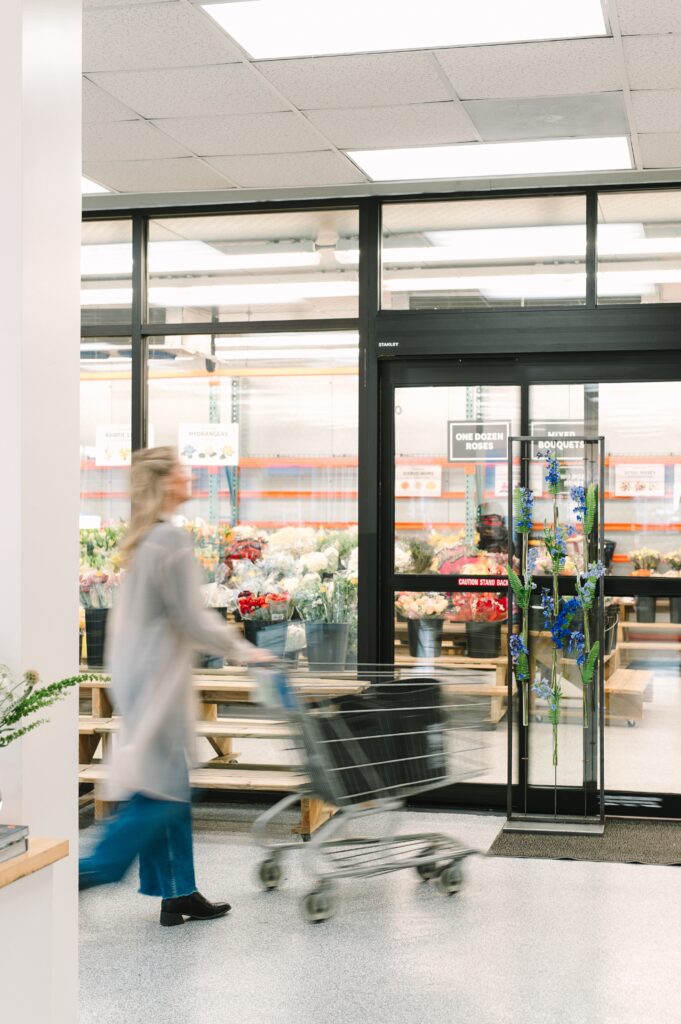 Motion shot of a customer entering the flower cooler at Wholesale Flower Market in Richmond, Virginia.