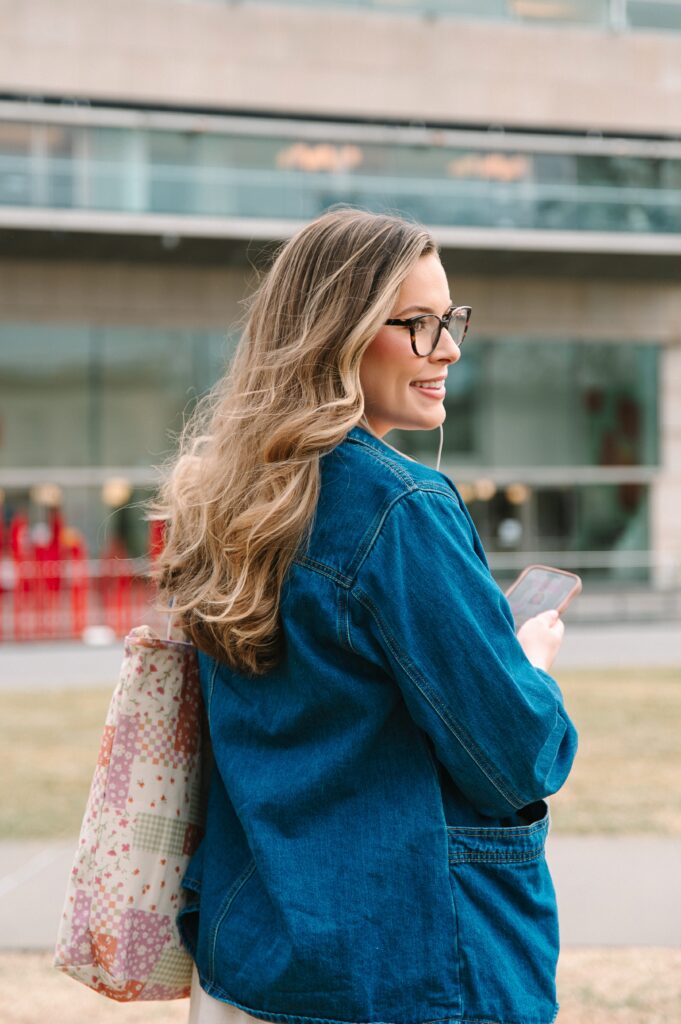 Boutique owner walking with tote bag during lifestyle branding photoshoot in Richmond VA