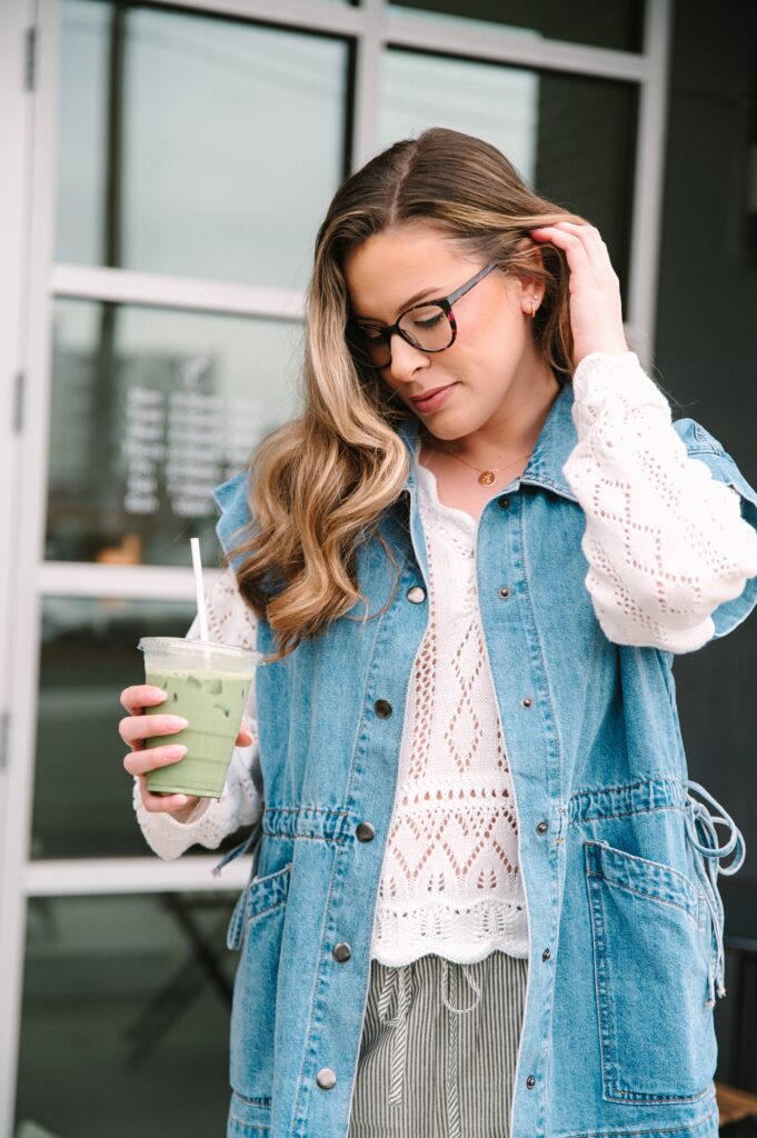Boutique owner holding a matcha drink during a lifestyle branding photoshoot in Richmond VA