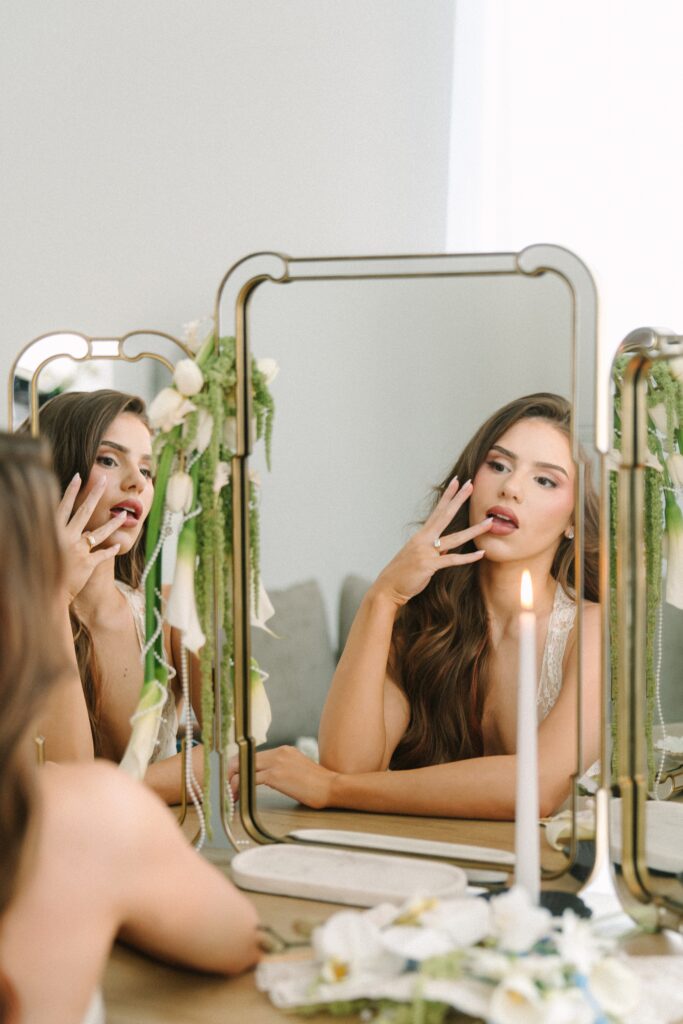 Editorial bridal beauty portrait reflected in mirror.