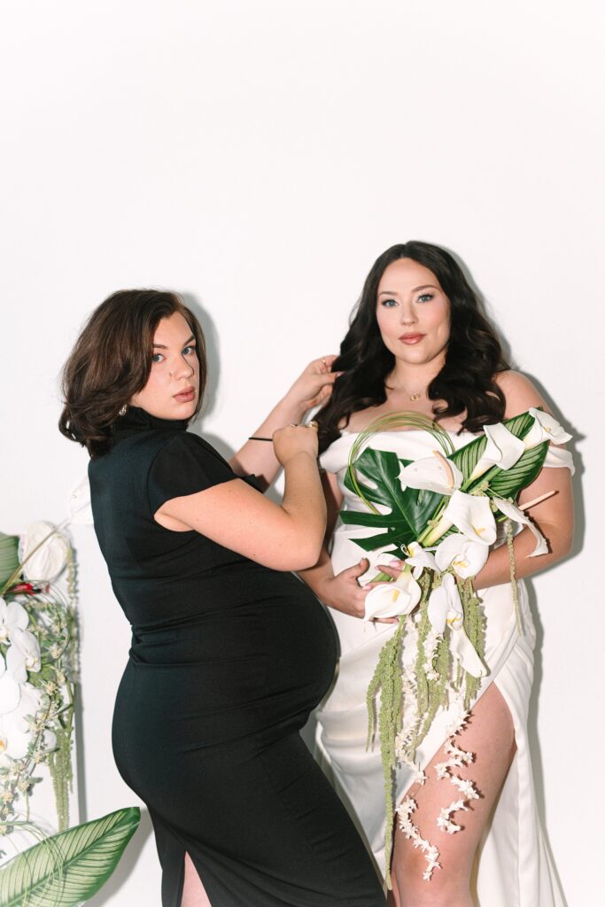 Makeup artist posing with bride during a editorial bridal photoshoot.