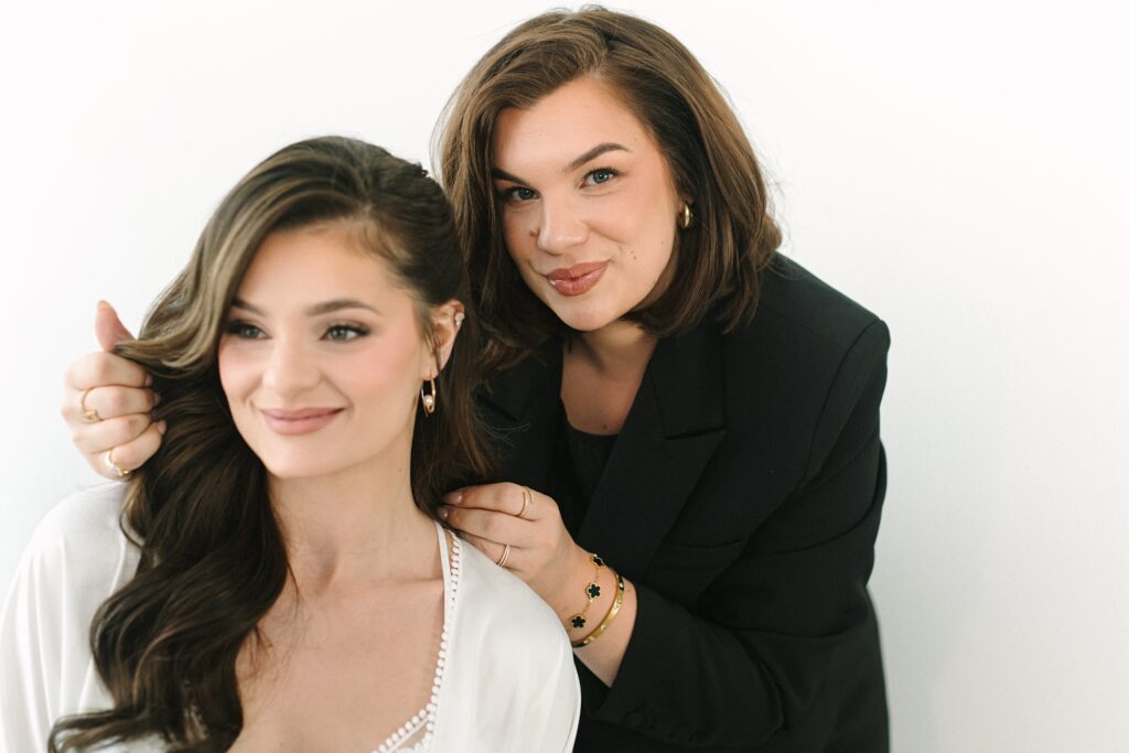 Luxury wedding makeup artist Rachel of RCD Artistry styling a bridal client by a Richmond branding photographer.