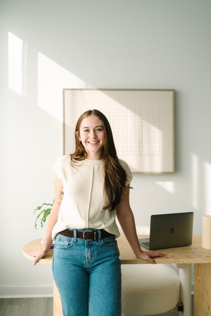 Therapist standing at desk during a branding photography session