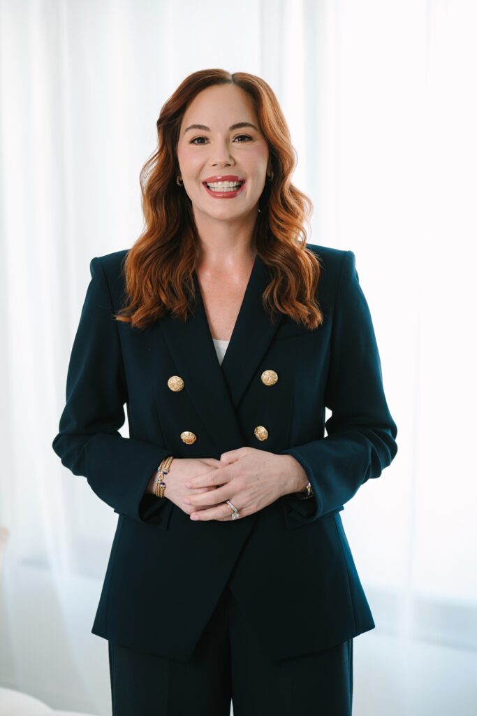 Studio headshot in Richmond VA of a female professional wearing a navy suit